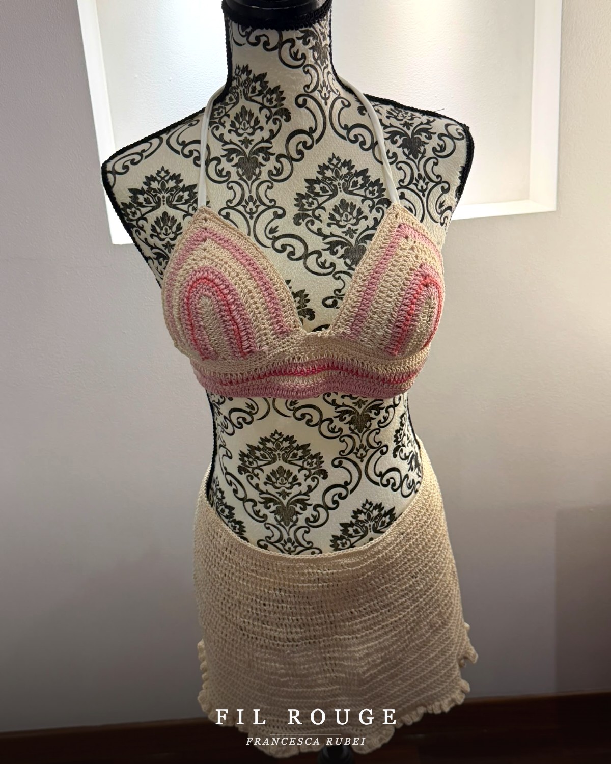 Blush crochet bikini set on a vintage mannequin