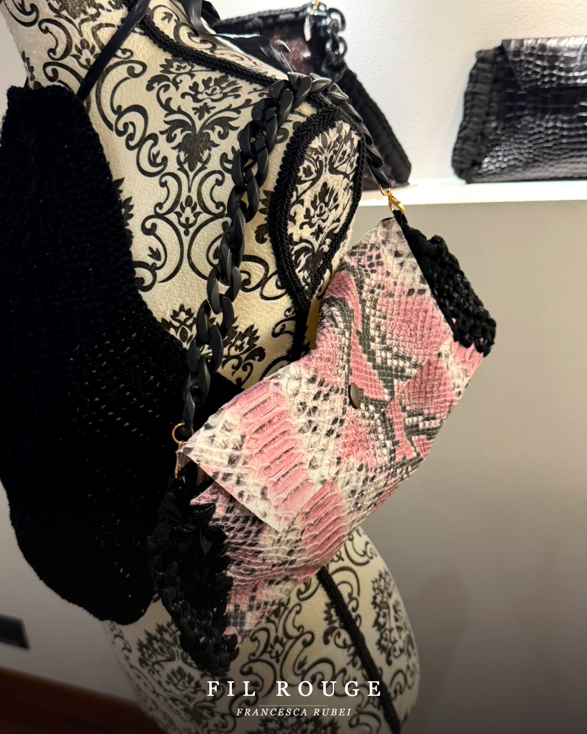 Pink python-print clutch