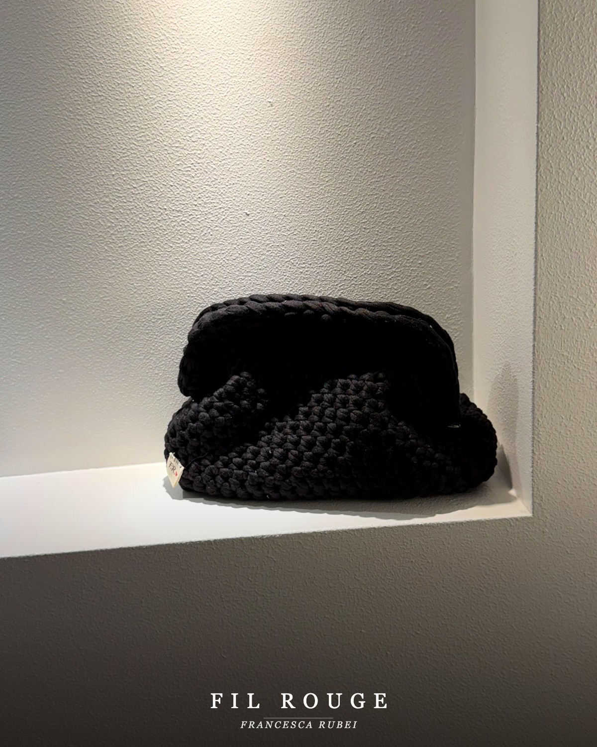 Black knit clutch bag