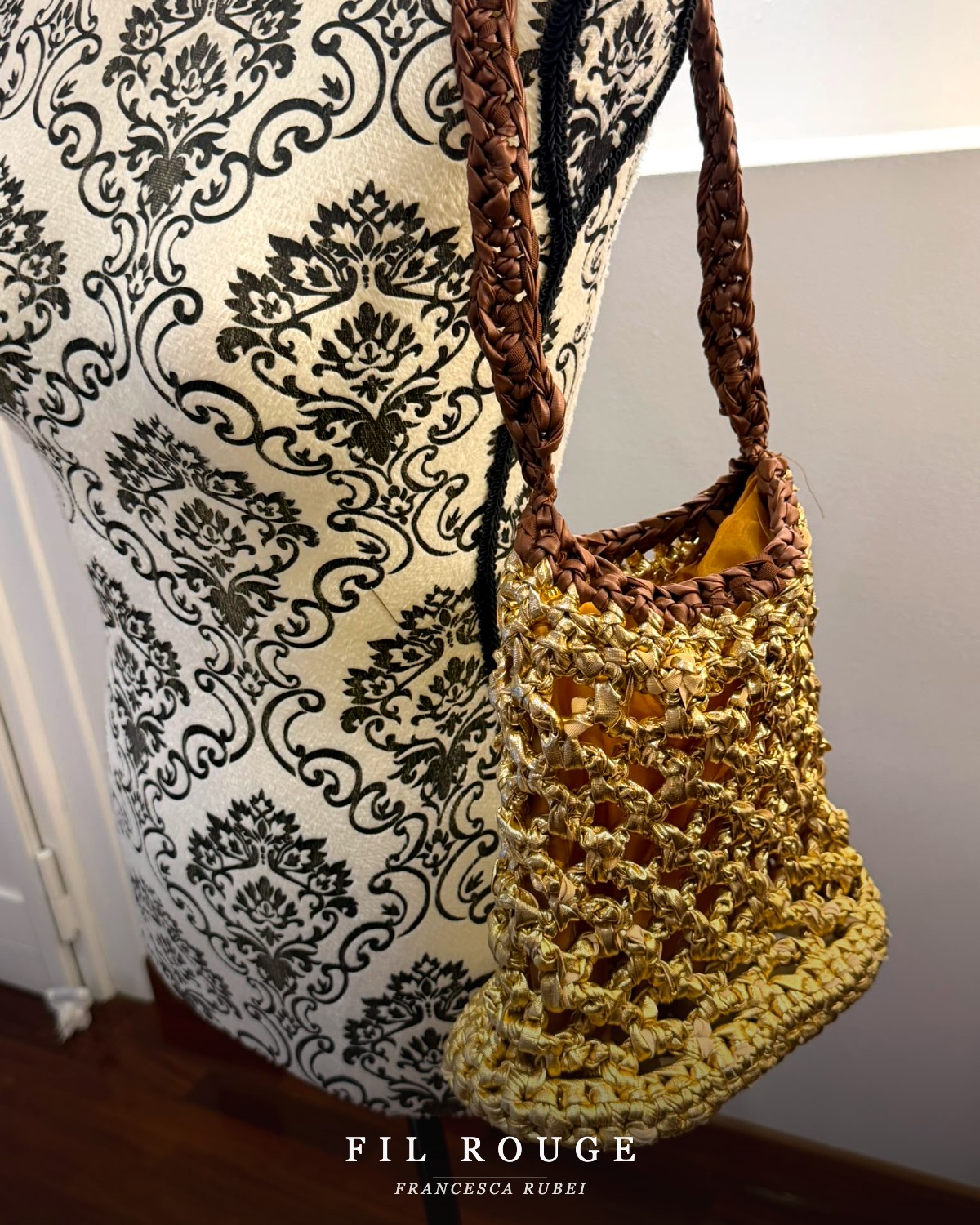 Gold woven-ribbon bucket bag with braided brown strap